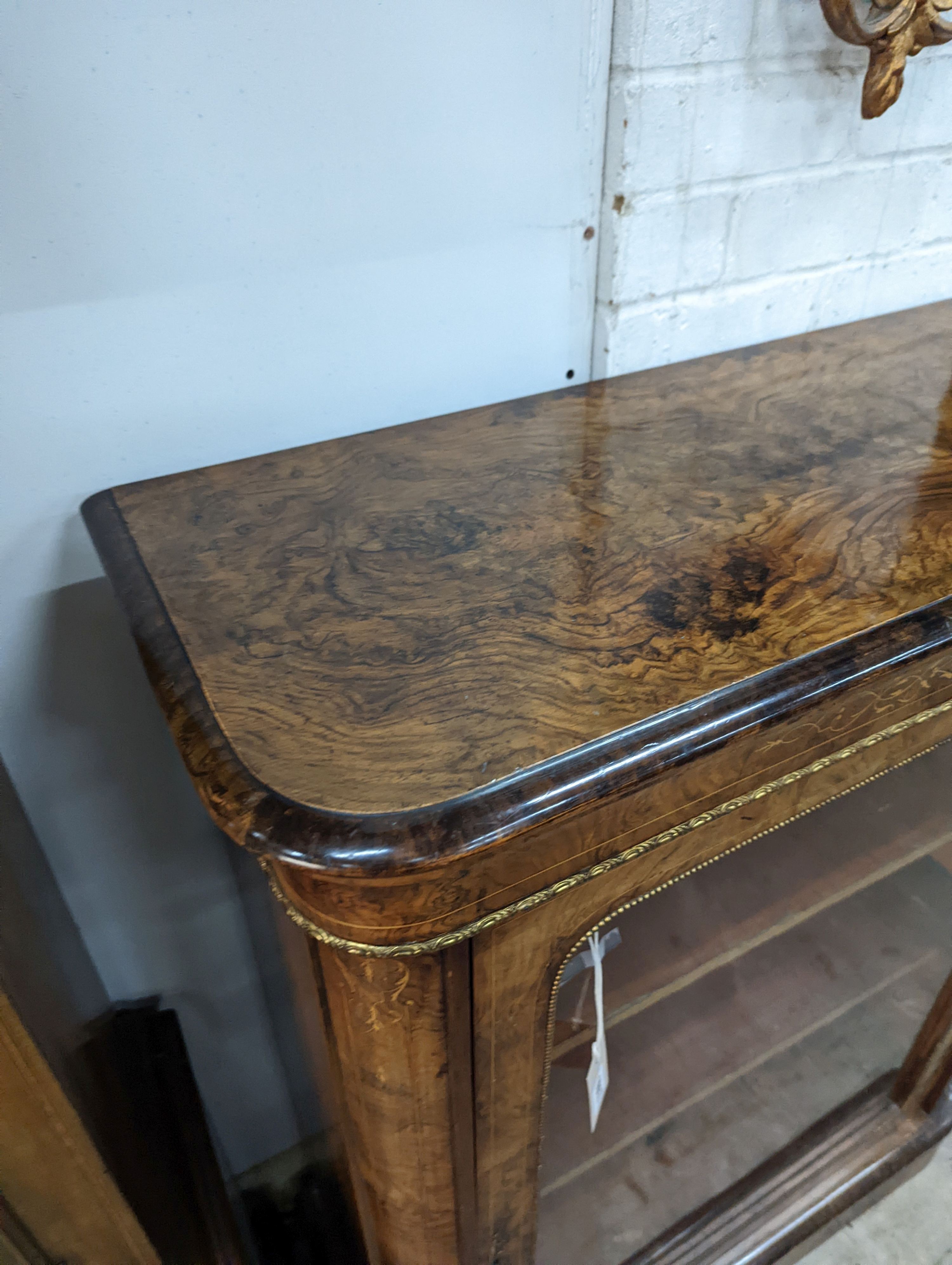 A Victorian inlaid gilt metal mounted figured walnut pier cabinet, width 84cm, depth 35cm, height 105cm